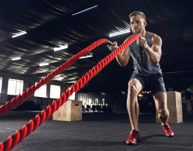 A man doing rope exercises