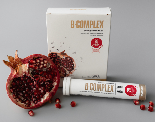 B-Complex Effervescent Tablets box, tube and a pomegranate