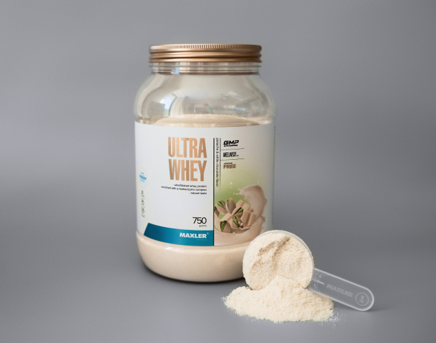 Ultra Whey bottle and scoop with powder