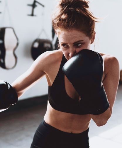 A woman in boxing gloves