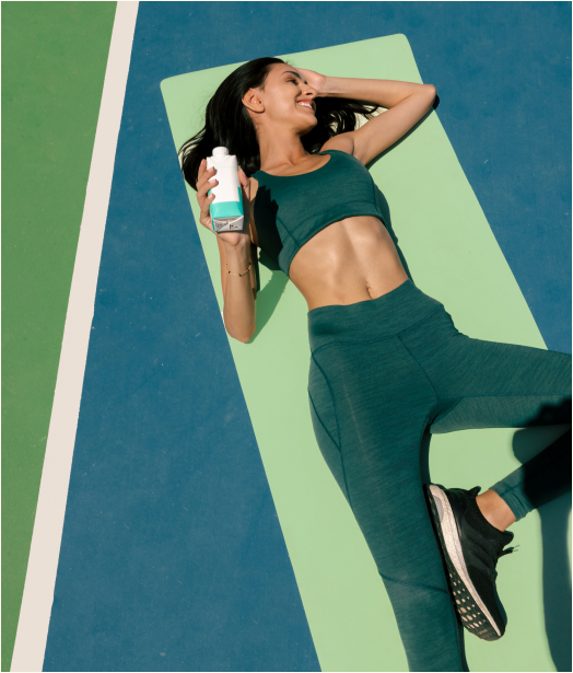 A woman lying on a yoga mat